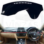 Black custom car dashboard cover installed in a BMW 320 D