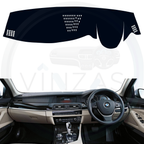 Black custom car dashboard cover installed in a BMW 520 D