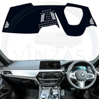 Black custom car dashboard cover installed in a BMW 530D