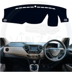 Black custom car dashboard cover installed in a Xcent 
